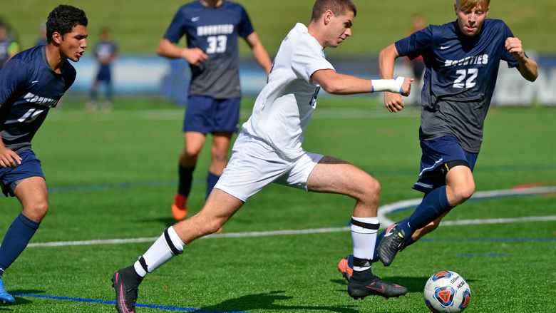 Penn State Behrend soccer player Richard Blanchard advances the ball