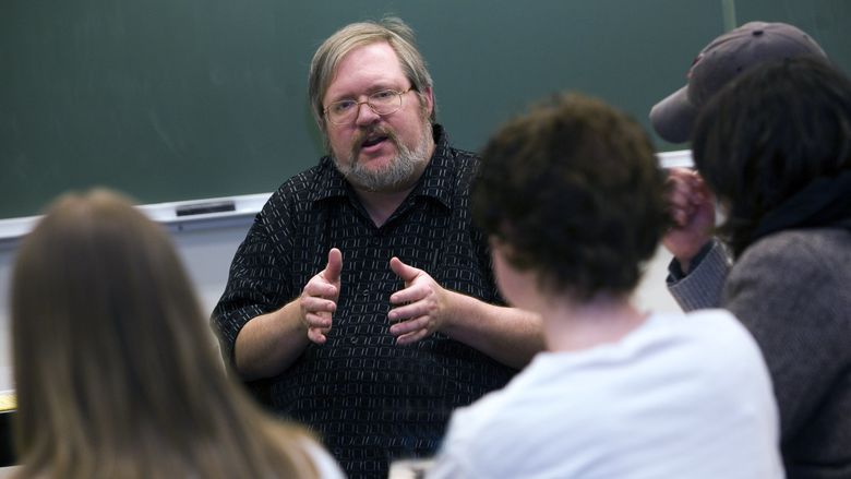 Penn State Behrend professor George Looney in a classroom with students