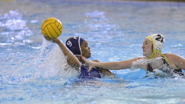 Penn State Behrend water polo player Lauren Wood prepares to throw the ball.