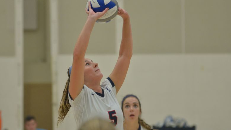 Penn State Behrend volleyball player Lexi Irwin sets the ball.