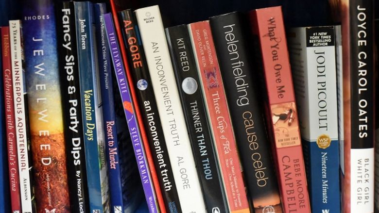 A close-up photo of books on a shelf at Penn State Behrend