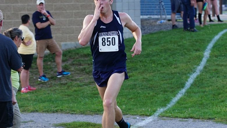 A Penn State Behrend cross country runner competes in a race.