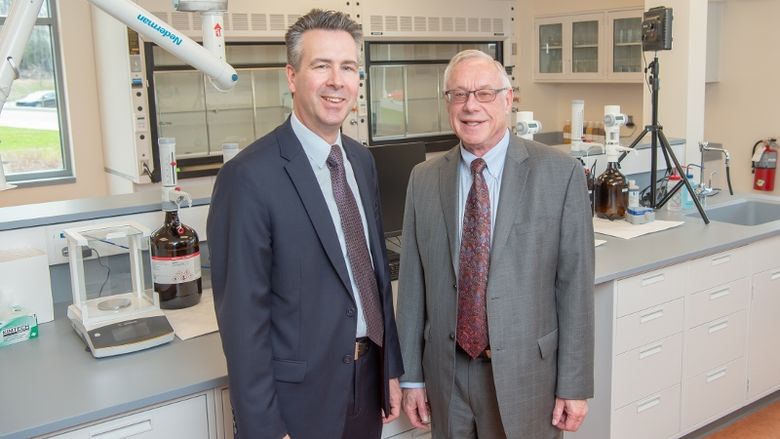 Penn State Behrend Chancellor Ralph Ford and HERO BX founder Pat Black pose in a research lab at Penn State Behrend.