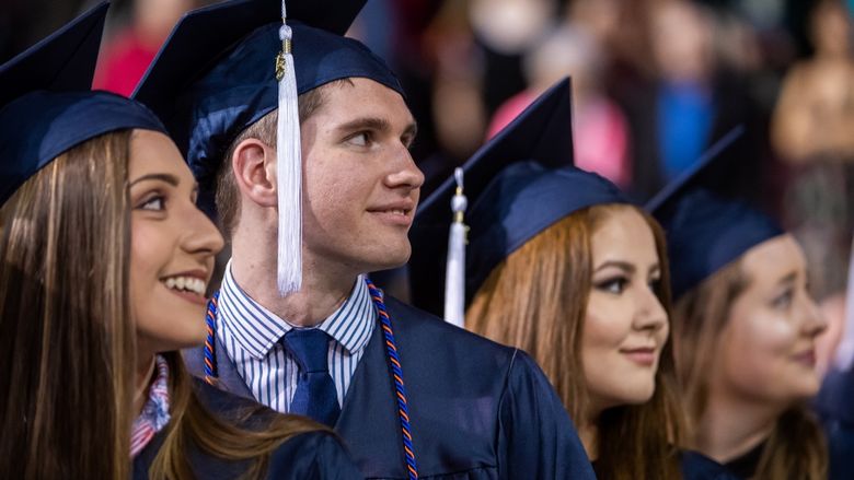 Students sit at Penn State Behrend's spring commencement ceremony.