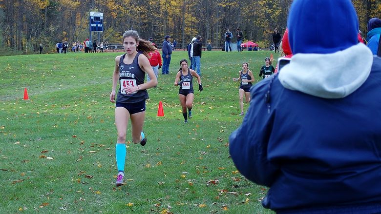 Penn State Behrend cross country runner Savanna Carr competes in a race.