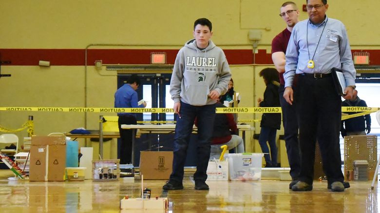 A student tests a rubber-band powered vehicle during a Science Olympiad event at Penn State Behrend