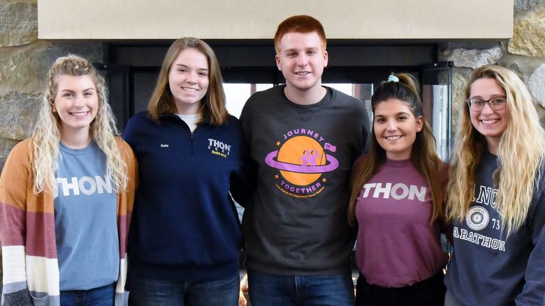 Five Penn State Behrend students pose for a group photo before THON.