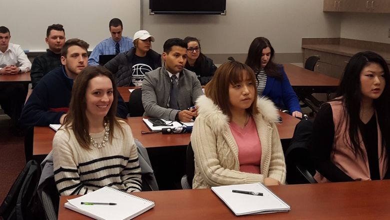 Accounting students sitting at a presentation