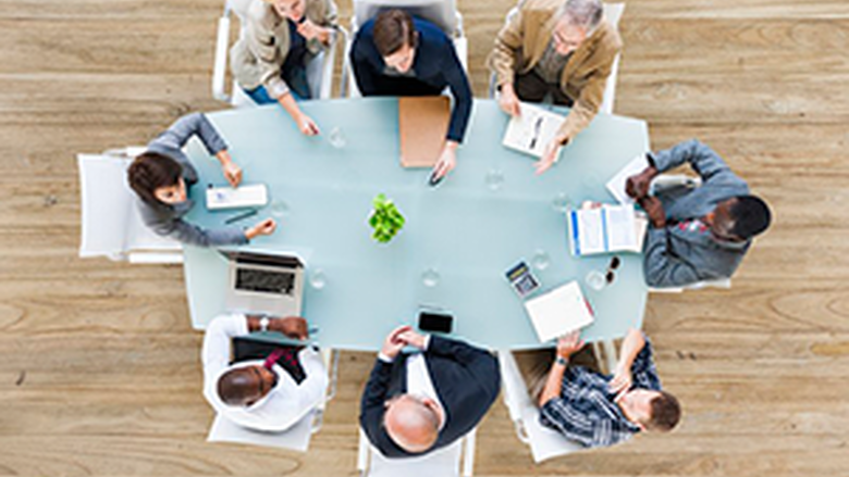 Aerial view of a business meeting at a conference room table