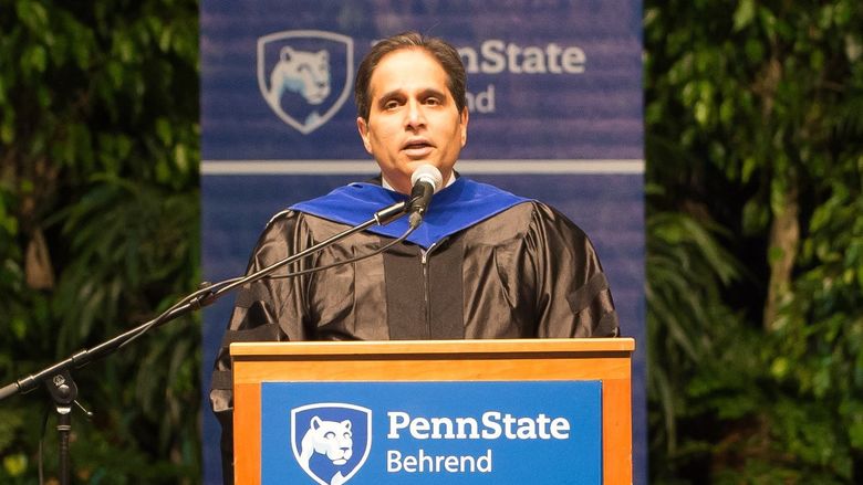 Ashutosh Deshmukh speaks during a Penn State Behrend commencement program.