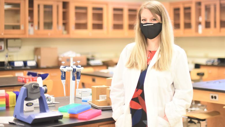 A portrait of Penn State Behrend faculty member Ashley Russell in one of the college's biology labs