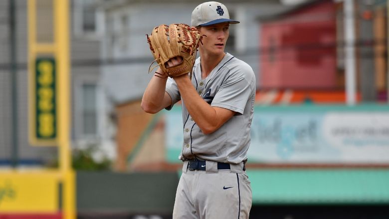A pitcher for the Penn State Behrend baseball team prepares to throw the ball.