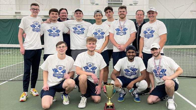 The Penn State Behrend men's tennis team poses with the trophy after winning the AMCC championship.