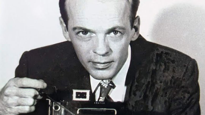 A portrait of Norman B. "Bill" Patterson with his camera
