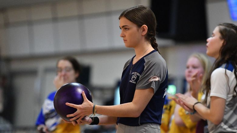 A member of the Penn State Behrend women's bowling team prepares to roll the ball.
