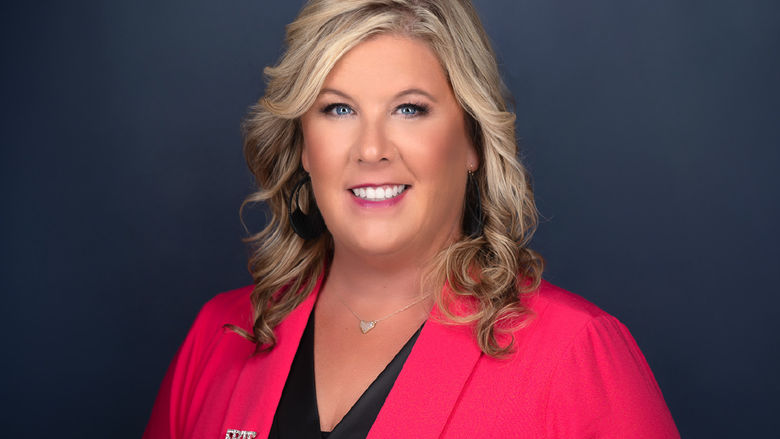 A portrait of Ainslie Brosig, executive director of the ExpERIEnce Children's Museum
