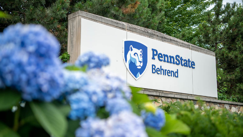 Flowers in front of the Penn State Behrend entrance sign