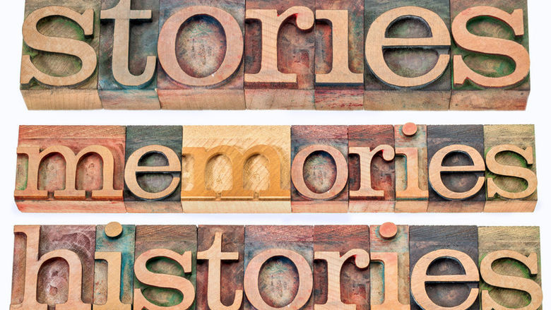 An illustration of wood-block letters spelling "stories, memories, histories."