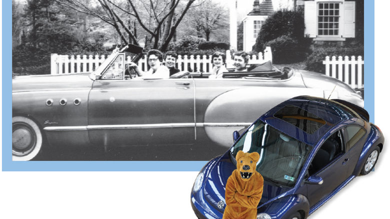 Women drive an older car, while the Behrend Lion leans against a newer VW Beetle.