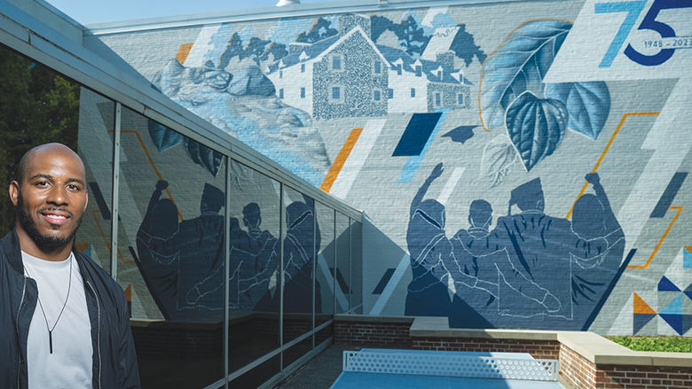 “Behrend Pride,” a temporary mural painted by Erie artist Ceasar Westbrook, features depictions of Glenhill Farmhouse, Wintergreen Gorge, and the silhouettes of four graduates standing arm-in-arm at commencement.