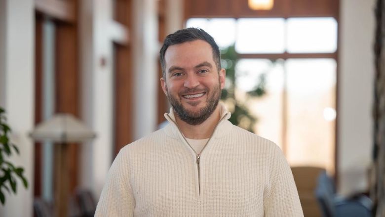 A portrait of Alumni Achievement Award recipient Connor Sattely