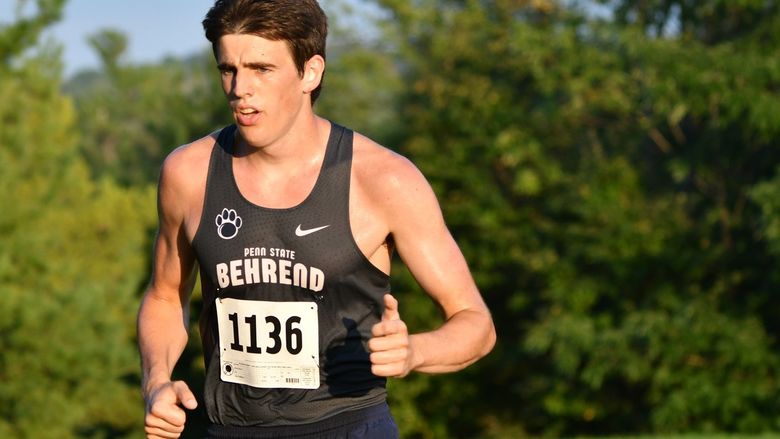 Penn State Behrend runner Phoenix Myers competes in an 8K race.