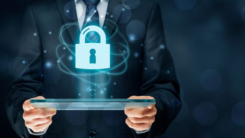 An illustration of an office worker holding a secure laptop.