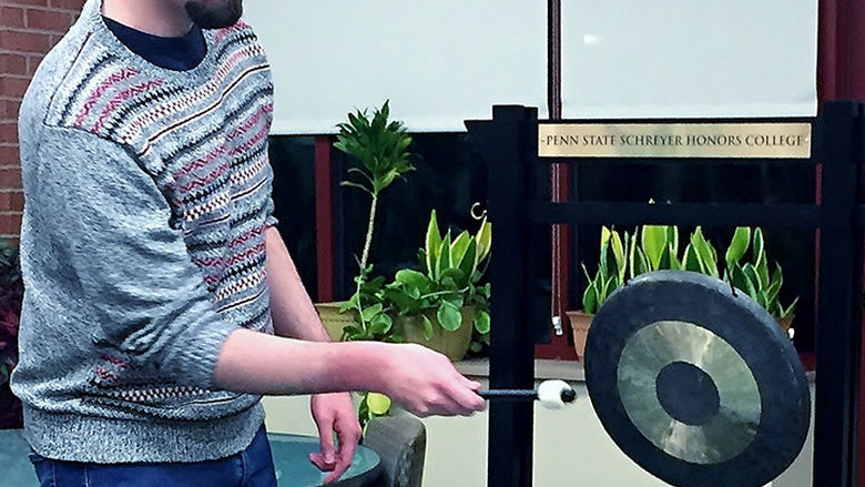 Ben Gauge, who graduated in December with dual degrees in Creative Writing and History, was the first to ring Behrend's gong this year