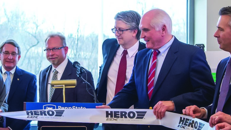 Pat Black, far left, founder and CEO of HERO BX, cuts the ribbon on the new biofuels research center in Knowledge Park. Black was joined by numerous government, industry, and Behrend officials, including Chancellor Ralph Ford, second from right, and Dr. Martin Kociolek, fourth from right, director of the School of Science.