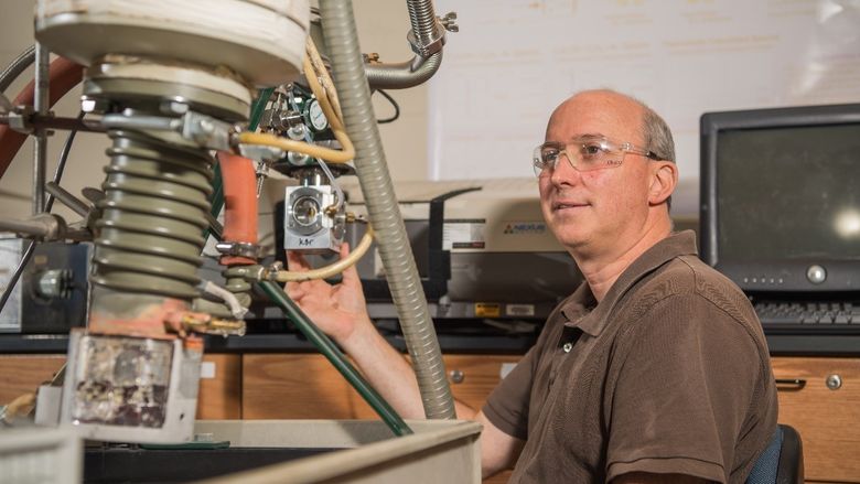 Jay Amicangelo, professor of chemistry at Penn State Behrend, works in his lab at the college.