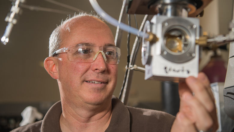 Jay Amicangelo, professor of chemistry at Penn State Behrend, works in the lab.