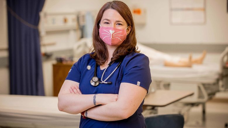 Penn State Behrend alumna Katie Woodworth poses in the college's nursing simulation lab.
