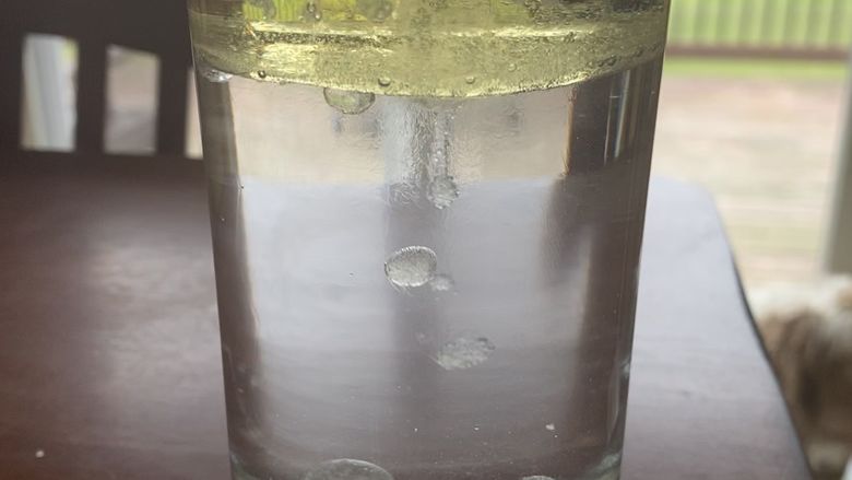 Oil in Water experiment in clear glass