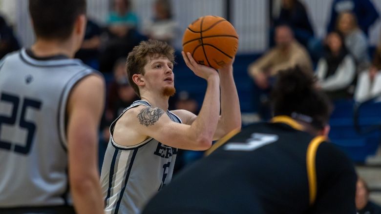 A Penn State Behrend basketball player shoots a free throw.