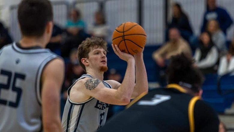 A Penn State Behrend basketball player shoots a free throw.