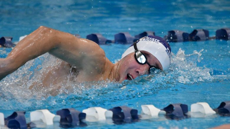 A male swimmer competes in a race for Penn State Behrend.