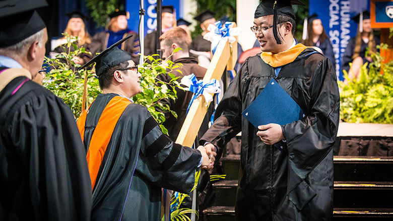 MMM student at commencement ceremony