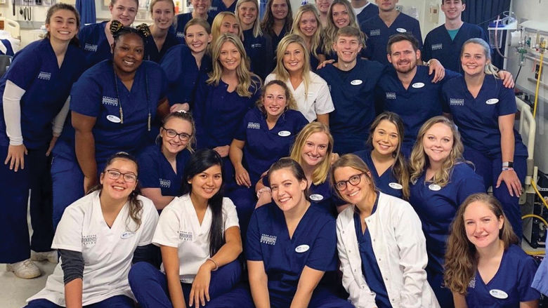 The COVID-19 pandemic upended a lot of traditional learning methods and disrupted hands-on opportunities, but perhaps no group of students at Behrend was in a more unusual position than upper-level Nursing students, like this group who were photographed in a nursing lab at Behrend before the pandemic.