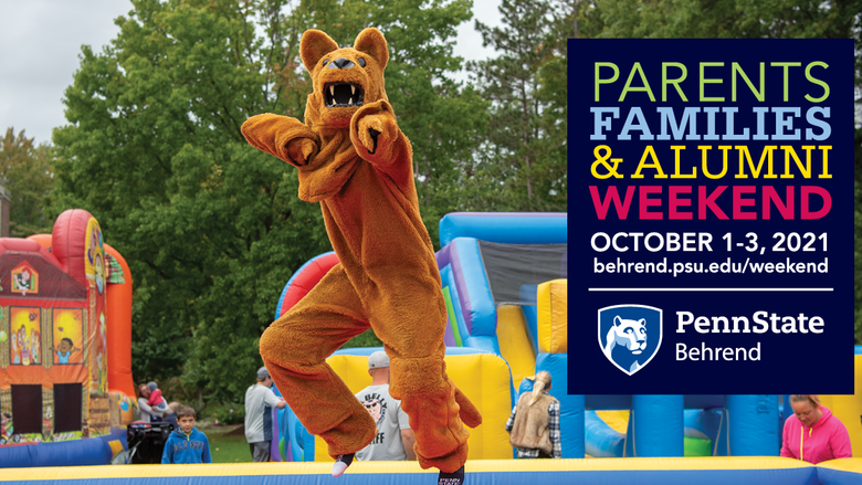 The Nittany Lion jumps on an inflatable during an event at Penn State Behrend.