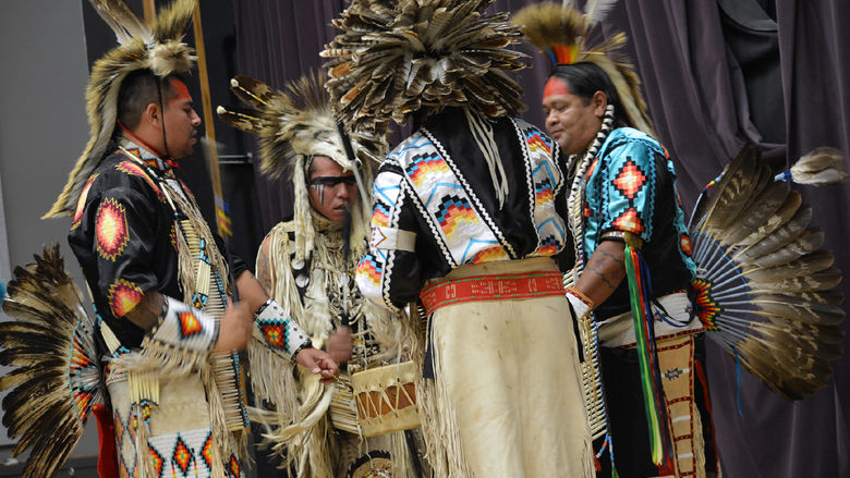 The Piscataway Nation Singers perform a traditional powwow dance.