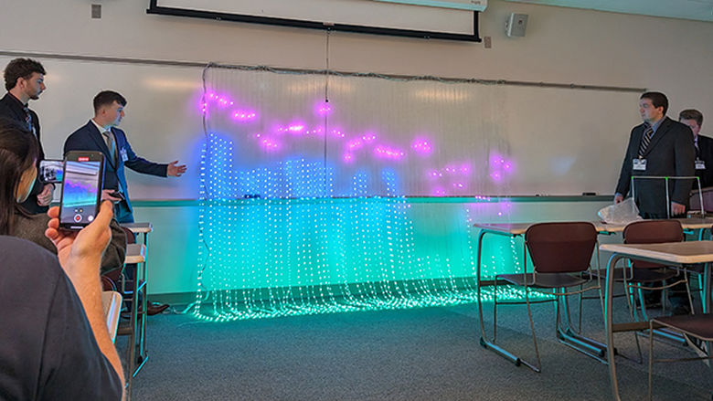 Behrend engineering students showing a lighting display they created