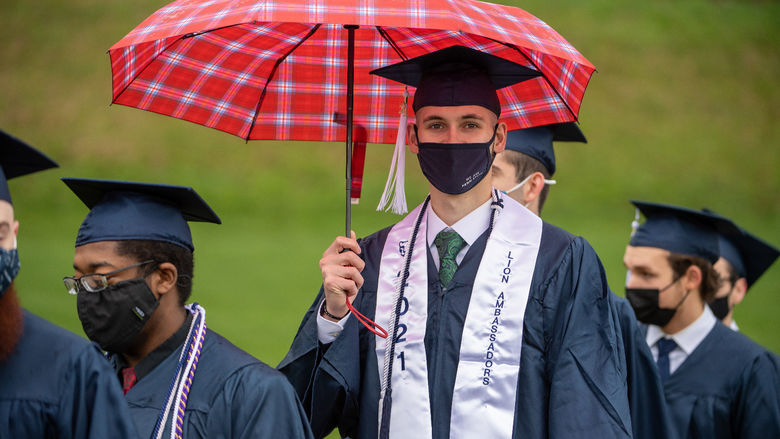 Penn State Behrend graduates line up to enter the stadium for the 2021 spring commencement.