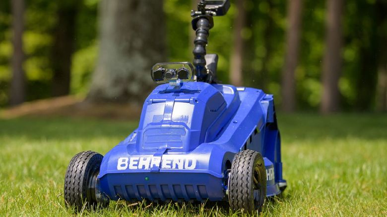 A close-up of the front of a remote-control lawn mower built by students at Penn State Behrend