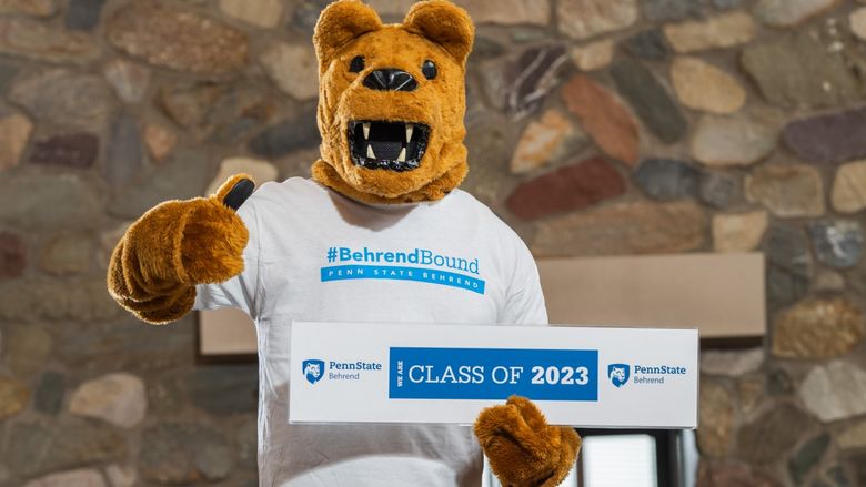 The Nittany Lion poses with a Class of 2023 sign