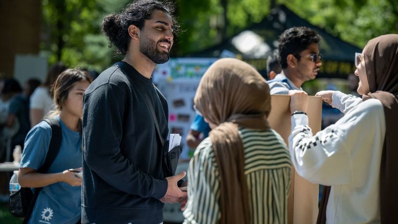 Students talk at the Penn State Behrend Discovery Fair.