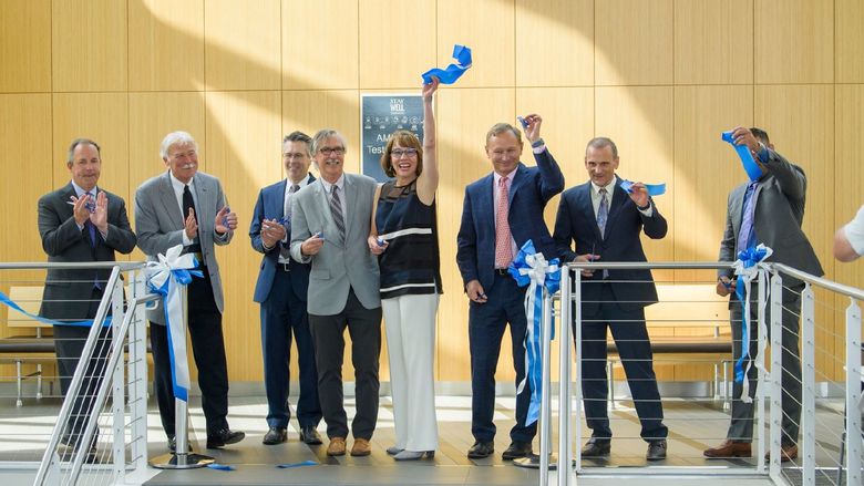Behrend Chancellor Ralph Ford and other partners cut the ribbon to open the new translational research lab at Penn State Behrend.