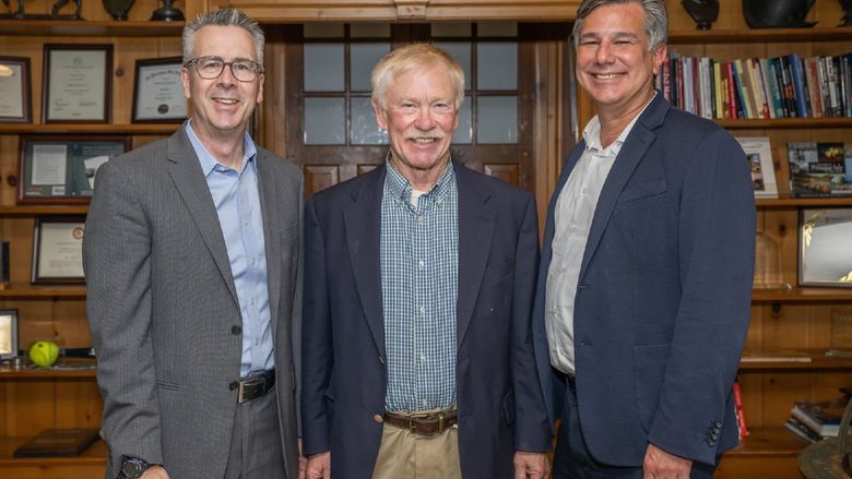 A portrait of Penn State Behrend Chancellor Ralph Ford, college friend Dave Meehl and Tim Kurzweg, the James R. Meehl Director of the School of Engineering.