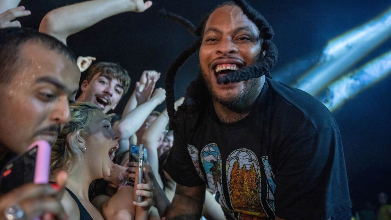 The rapper Waka Flocka Flame enters the crowd during a concert at Penn State Behrend.