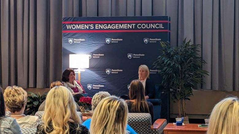 Melanie Ford talking on stage with Ashleigh Walters