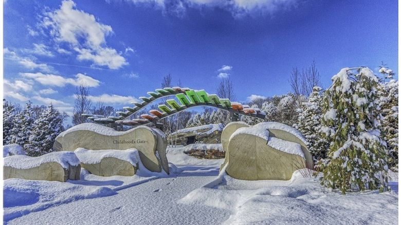 A photo of the entryway to a children's garden in the snow